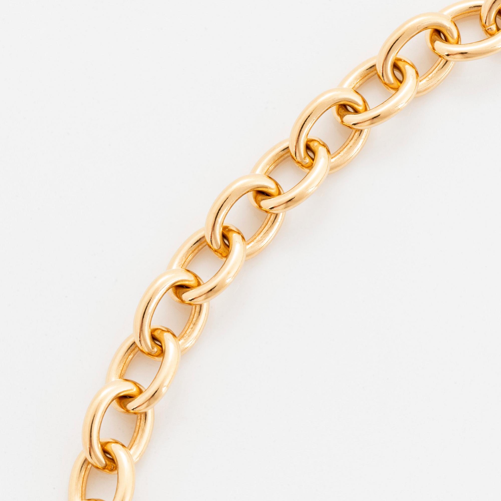 A Tiffany lock charm pendant necklace "1837" in 18K gold.