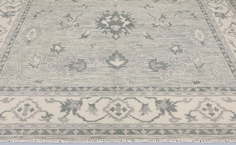 A rug, Ziegler design, approx. 368 x 279 cm.