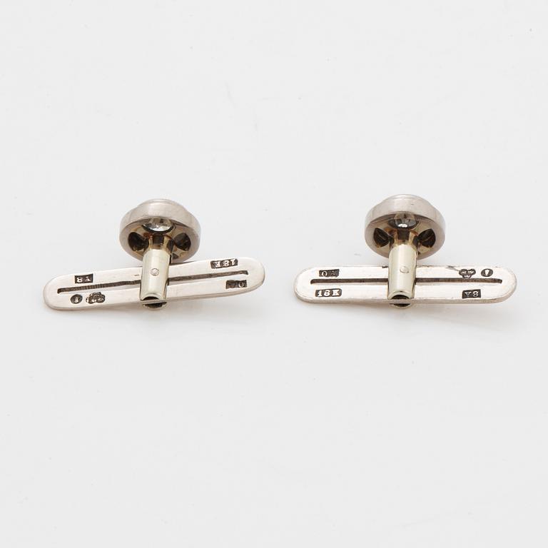 Brilliant-cut diamond shirt buttons.