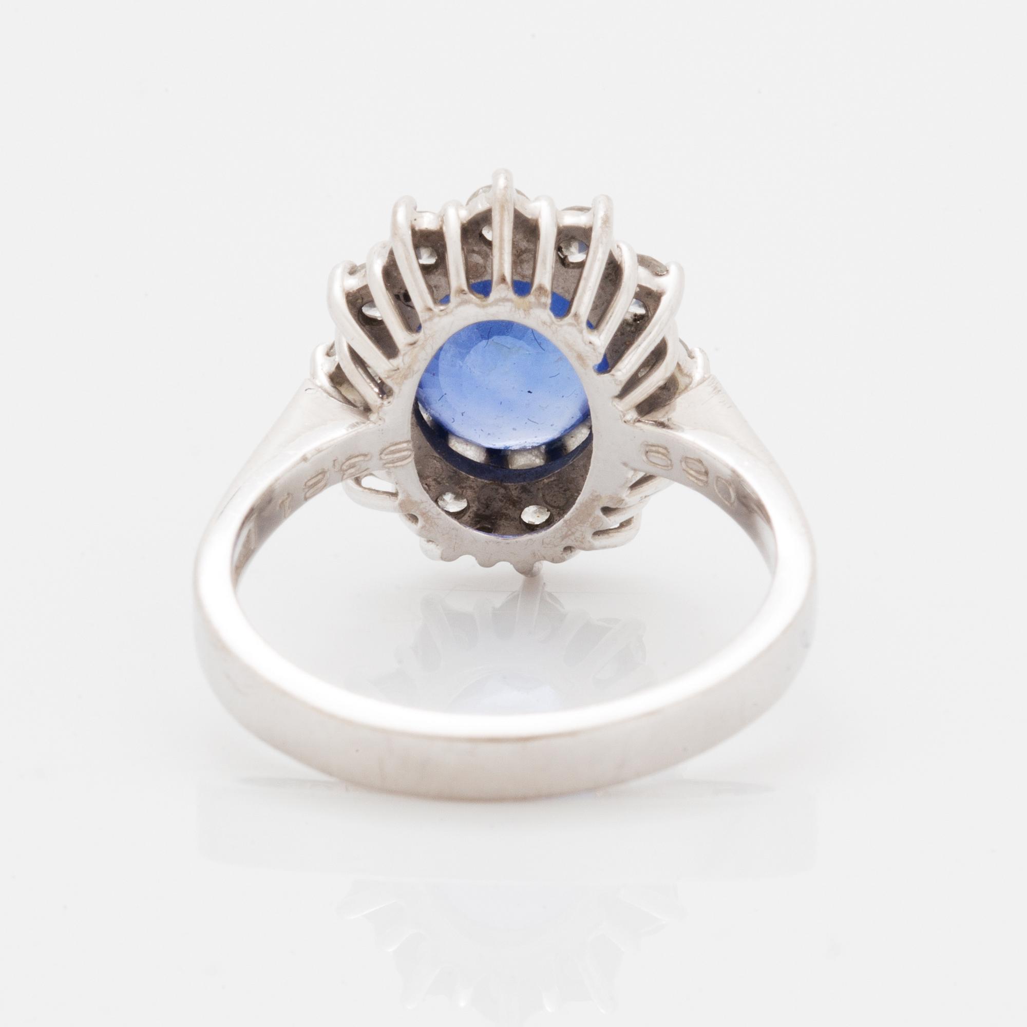 Oval faceted sapphire and brilliant-cut diamond ring.