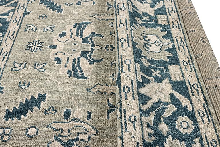 An oriental carpet with Mamluk design, c. 372 x 277 cm.