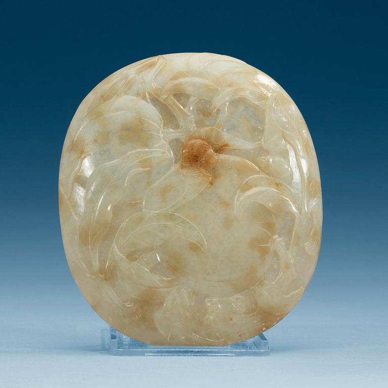 A carved nephrite placque with bats and peaches.