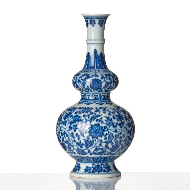 A blue and white gourd shaped lotus vase, presumably Chinese Republic with Qianlong mark.