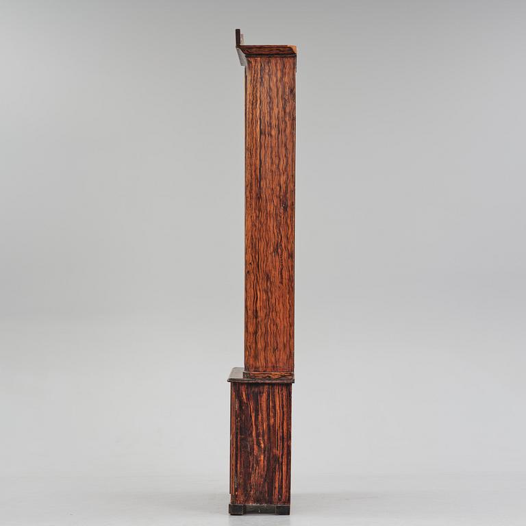 A Swedish faux-boix neo-gothic book cabinet, ca 1830.