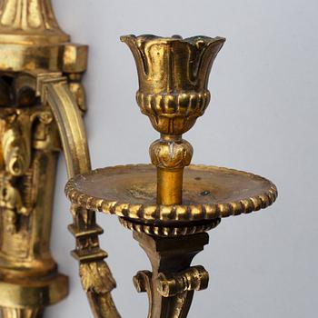 A pair of gilt bronze Louis XVI style wall lights. Late 19th century. 80.