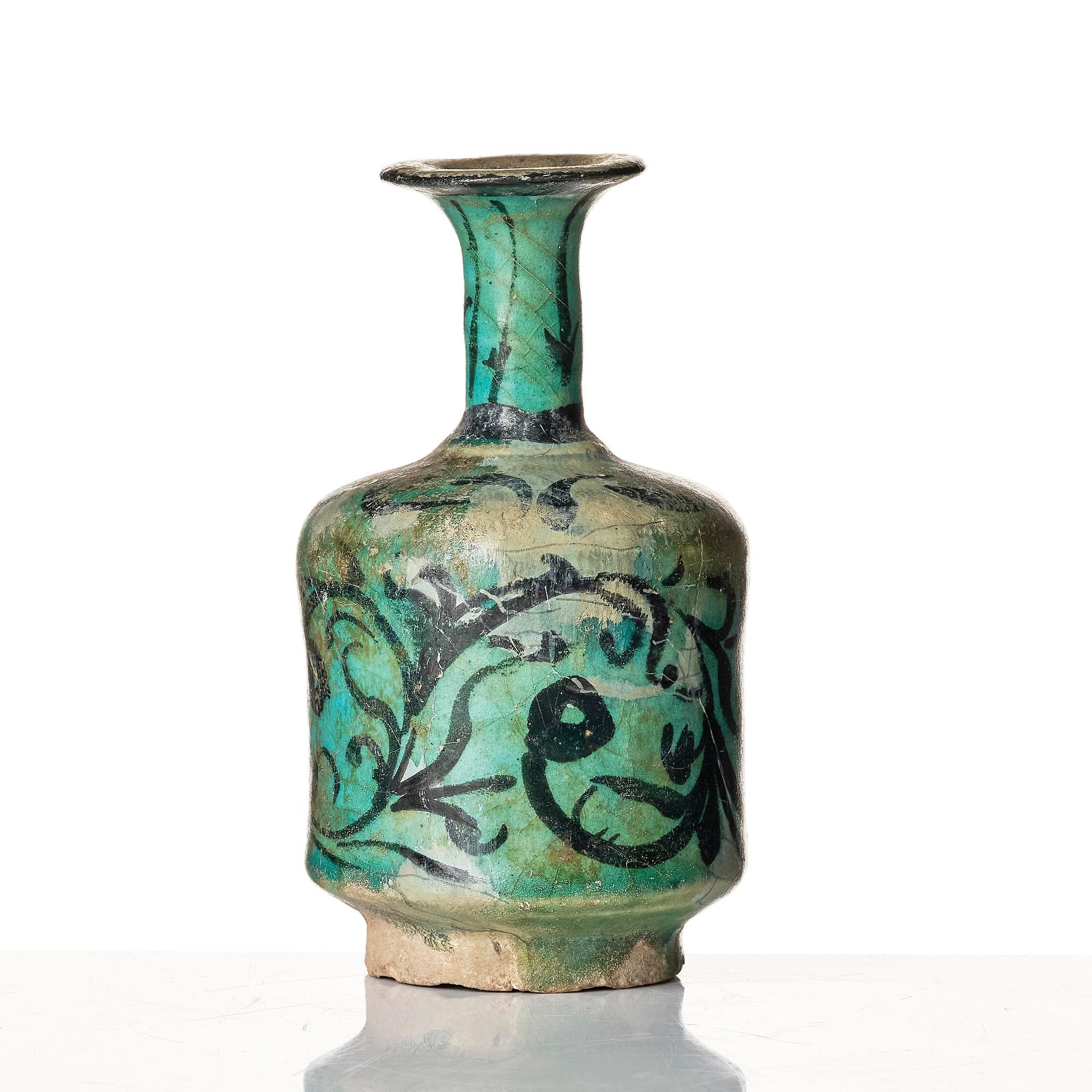 A Kashan turquoise blue-glazed ewer, central Persia (Iran), 11th to 12th century.