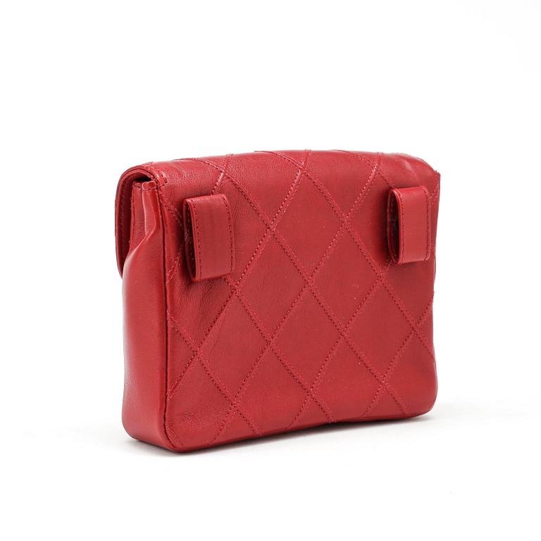 CHANEL, a red quilted leather bag / purse.