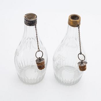 A pair of late gustavian glass and silver vinegar bottles, circa 1800.