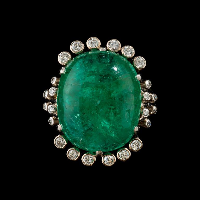 A cabochon cut emerald and diamond, 0.42 ct, ring.