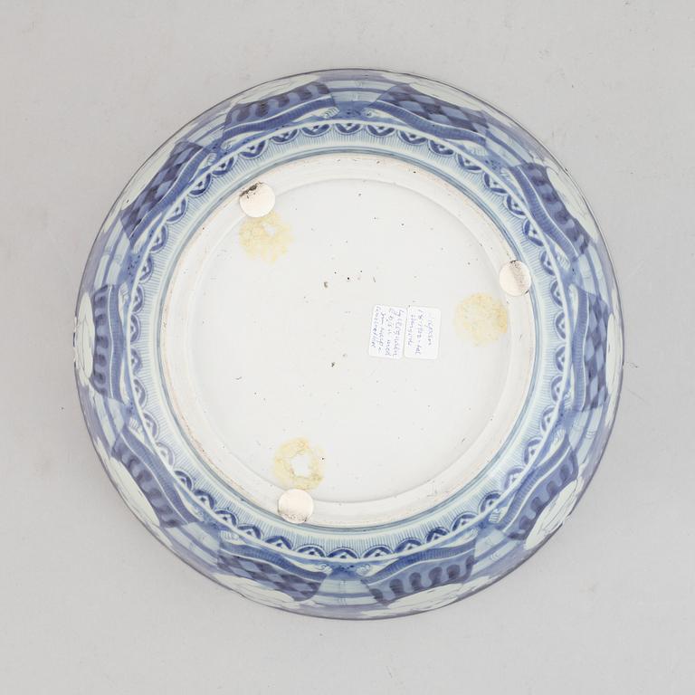 A Japanese blue and white stoneware bowl around the year 1900.