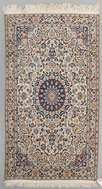 A RUG, Nain, around 200 x 113 cm.