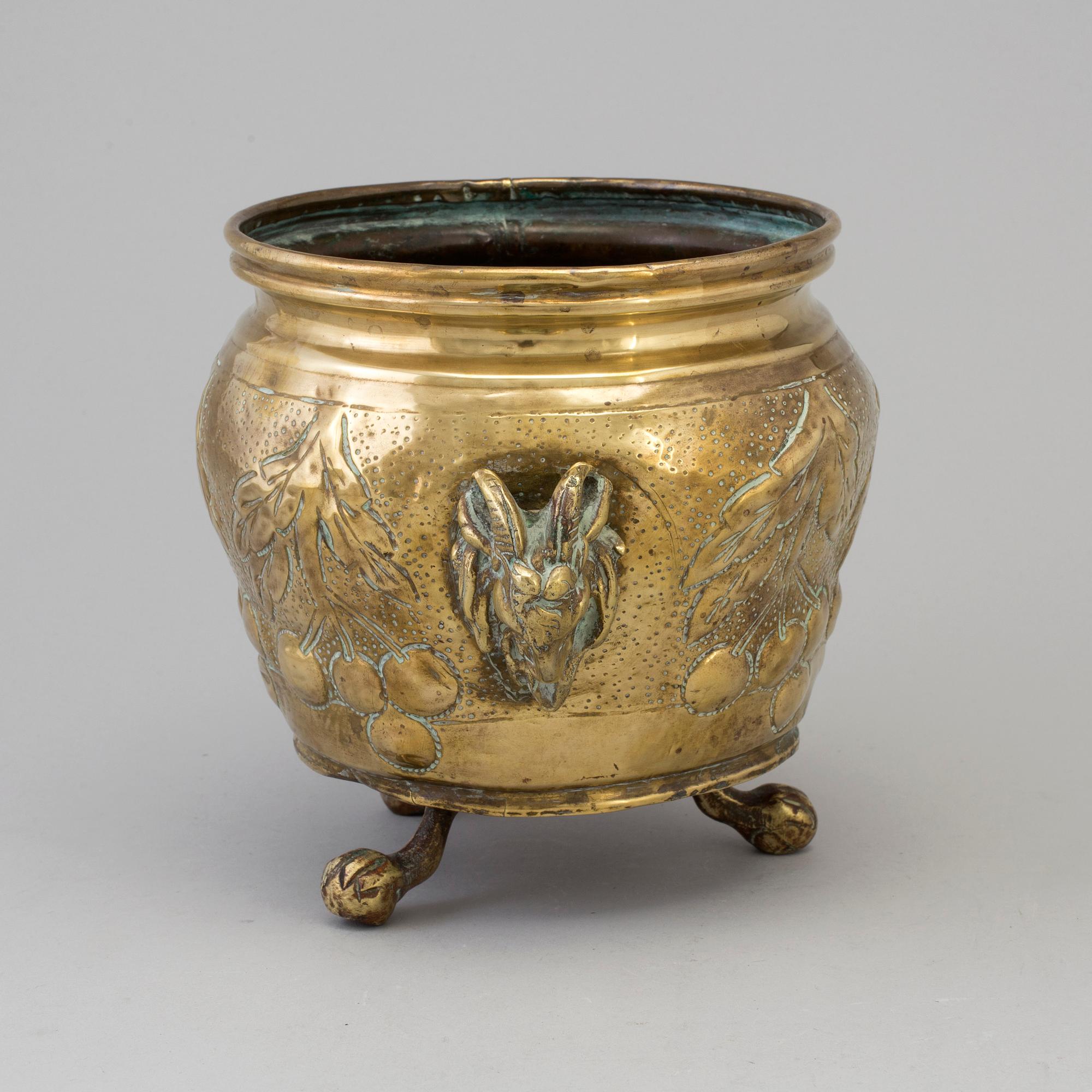 A 19TH CENTURY BRASS FLOWER POT.