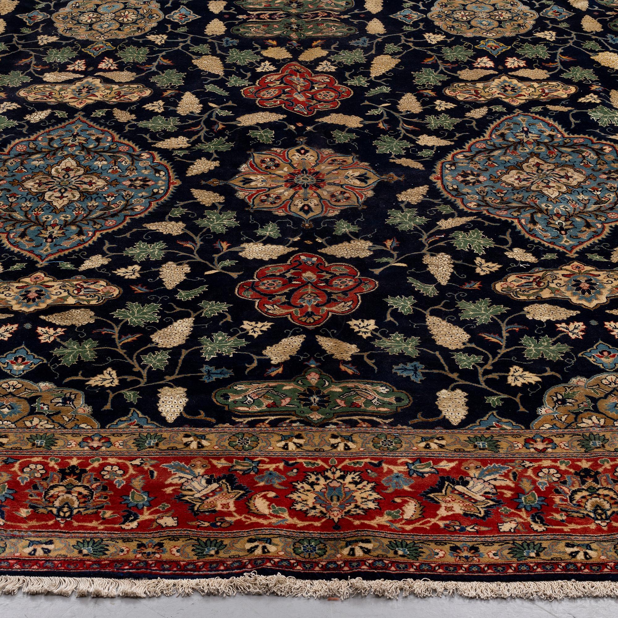 A CARPET so called Royal Kashan, part silk, signed, ca 483 x 311 cm.