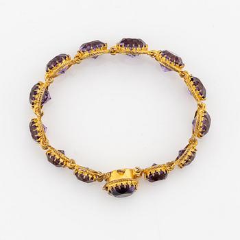 A necklace and a bracelet of gilded silver with faceted amethysts.