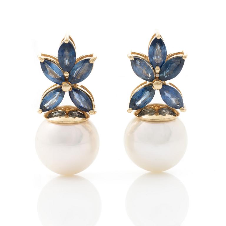 18K gold earrings with cultured Akoya pearls and navette-cut sapphires.