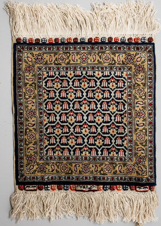 Four silk rugs/pads, probably Hereke, ca 33 x 33 cm.