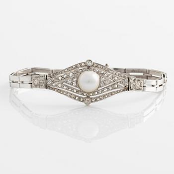 Bracelet in white gold with a half pearl and rose-cut and old-cut diamonds.