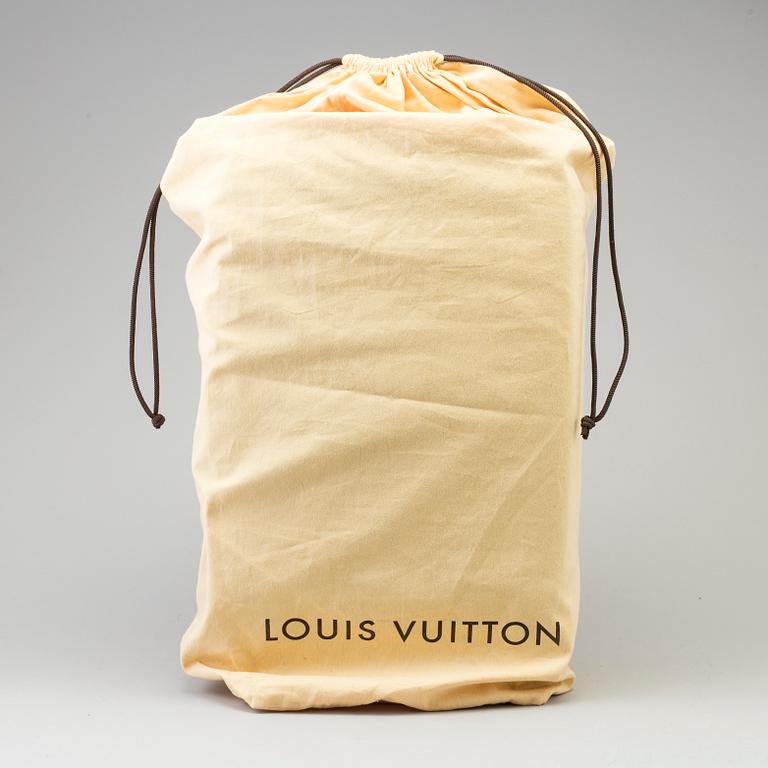 A Monogram Canvas "Zephyr" Suitcase by Louis Vuitton.