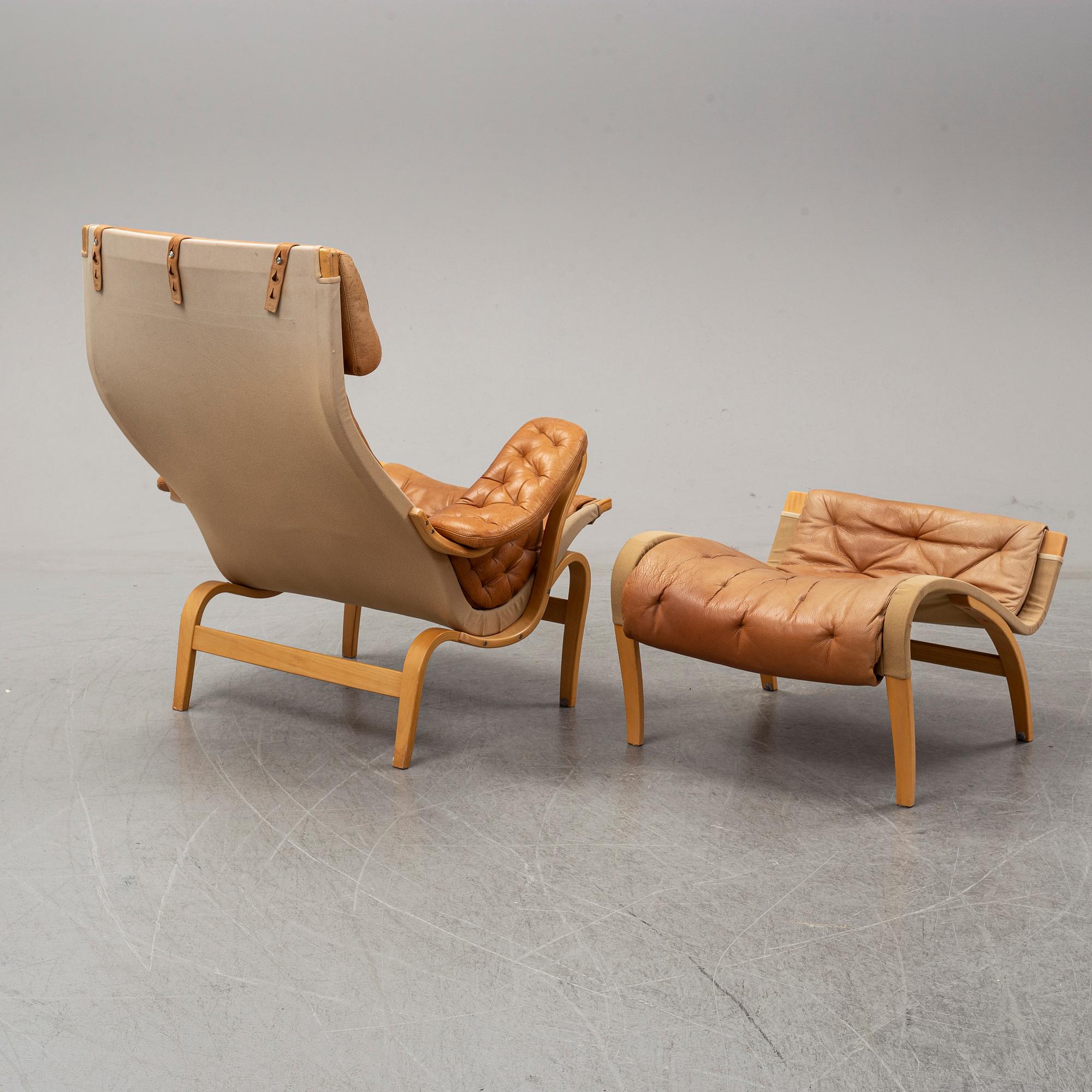 Bruno Mathsson, a "Pernilla" lounge chair with ottoman, DUX, Sweden, late 1900's.