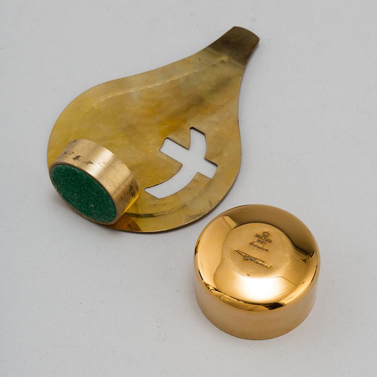 PIERRE FORSSELL, six gilt brass cups and a bottle, as well as candle holder, from Skultuna Bruk.