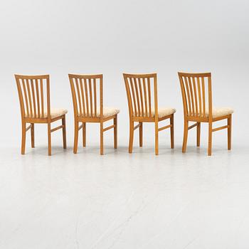 A set of four oak chairs with new  sheepskin upholstery.