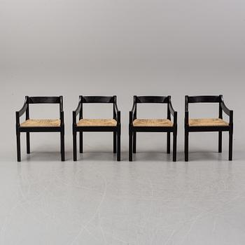 Vico Magestretti. Four black lacquered chairs with rope seats, "Carimate". Cassina, Italy.