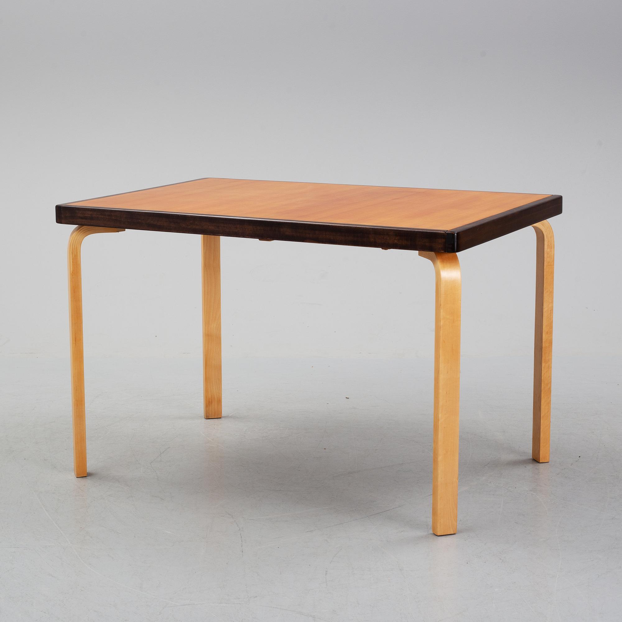 Alvar Aalto, a teak dining table, Artek, Finland, mid 20th Century.