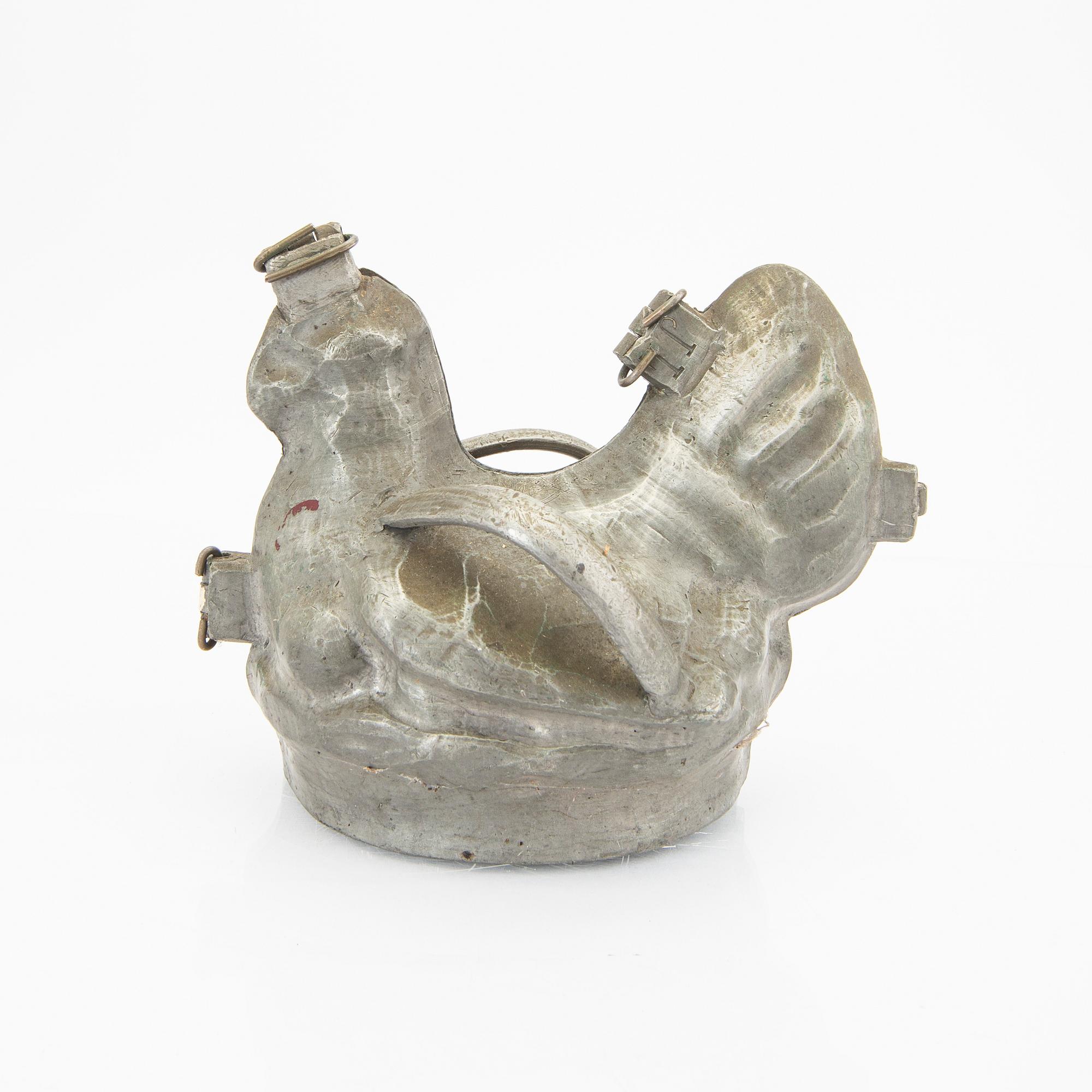 A set of four pewter icecream moulds around 1900.