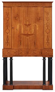 533. An Oscar Nilsson palisander cabinet on stand with stylized inlays, executed by  Wickman & Nybergs Möblerings- och Snickeriverkstad, Stockholm 1926.