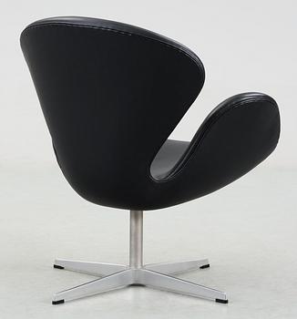 A Arne Jacobsen black leather "Swan" easy chair, Fritz Hansen, Denmark 2001.