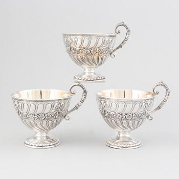 Three parcel-gilt silver chocolat-cups, mark of CG Hallberg, Stockholm 1896. Louis XVI-style.