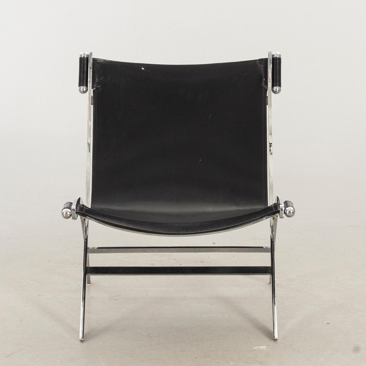 Paul Tuttle For Flexform Lounge Chair In Chrome And Black Leather.