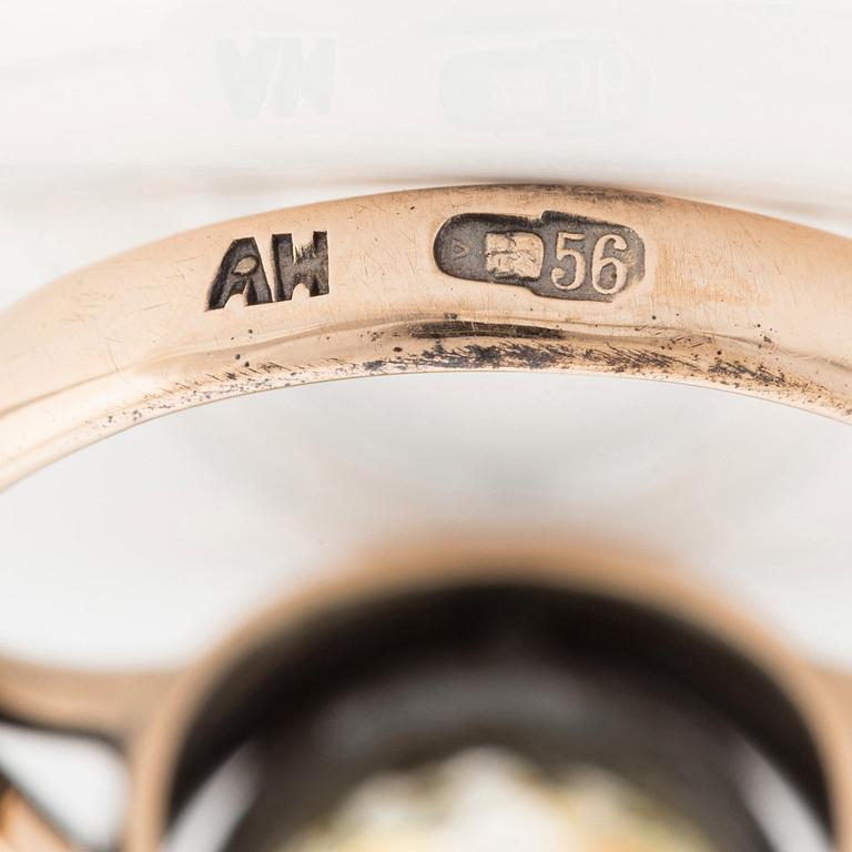 A 14K gold and silver ring with an old-cut diamond.