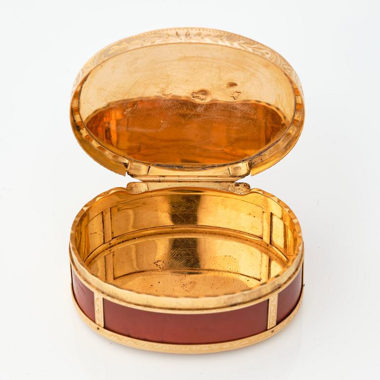 A French 18th century gold and red lacquer box, marked in Paris 1777-1778.