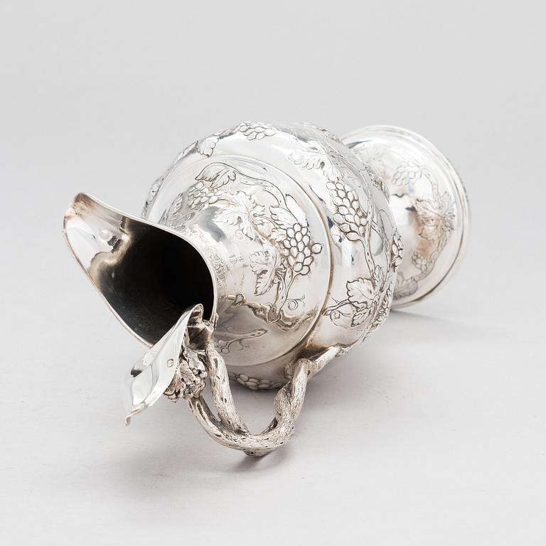 A George III sterling silver ewer by John Scofield, London, 1787.