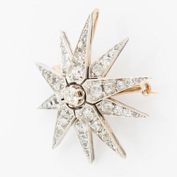 Brooch/pendant, in the shape of a star, silver and gold with old-cut diamonds.