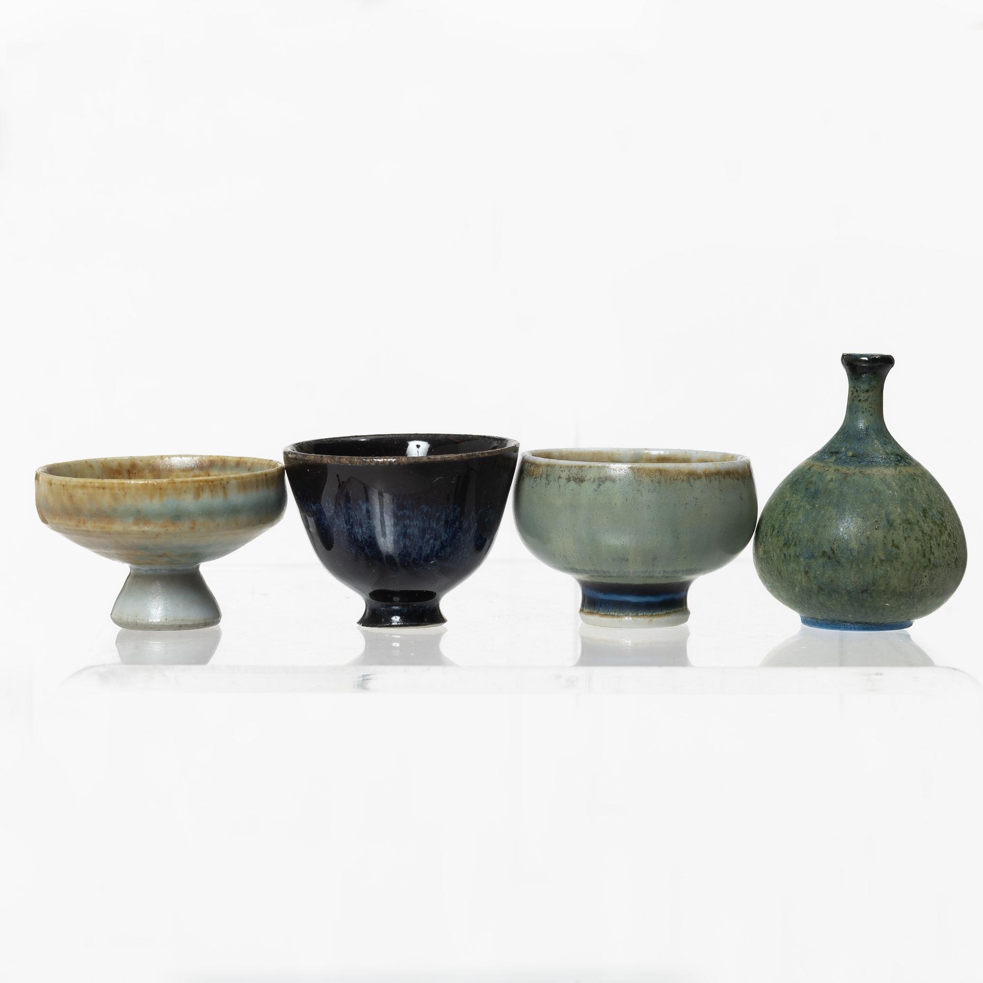 A set of fourteen stoneware vases and ten bowls, predominantly John Andersson, Höganäs.