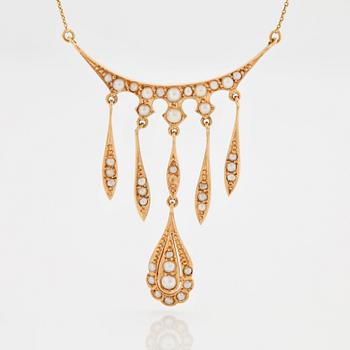 A NECKLACE set with seed pearls.