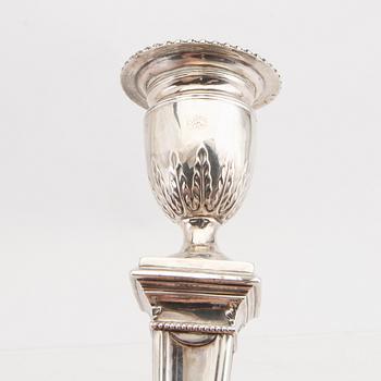 An English 20th century pair of silver candle sticks mark of Mappin & Webb London around 1900.