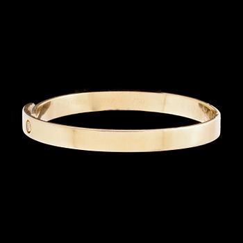 ARMRING, 18k guld besatt med diamant, ca 0,05 ct. Cartier. Vikt ca 39 g.