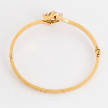 ARMRING, 18K guld och syntetisk vit spinell.
