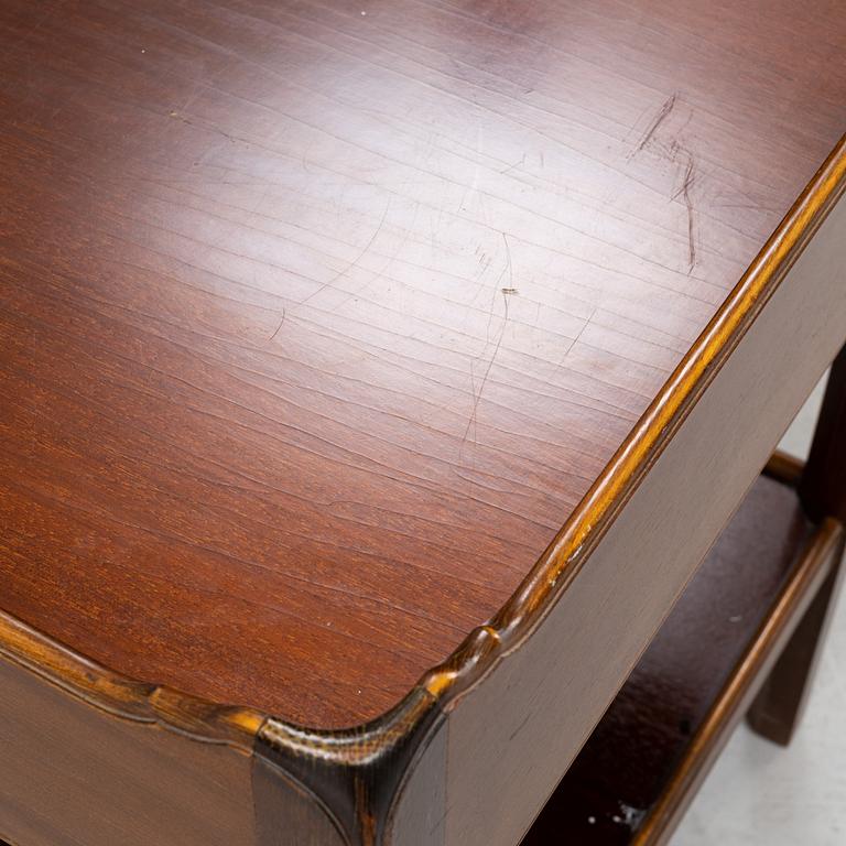 A pair of mahogany and stained beech bedside tables, mid 20th Century.