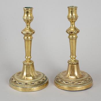 A pair of Louis Seize bronze candlesticks, late 18th century.