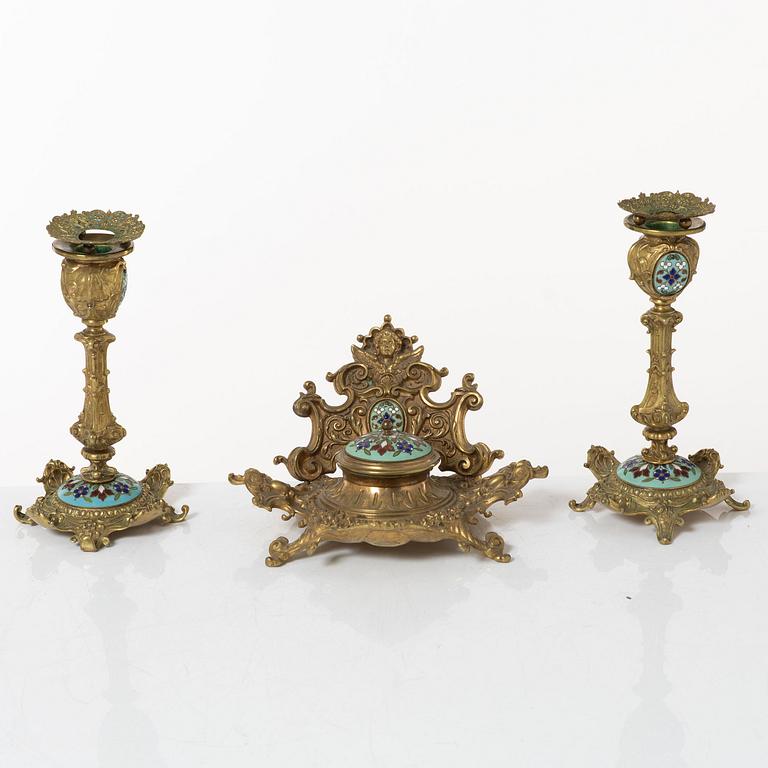 A pair candlesticks and an inkwell, circa 1900.