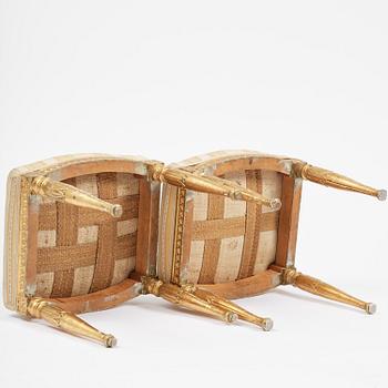 A near pair of late Gustavian giltwood stools, one by J. Hammarström (master in Stockholm 1794-1812).