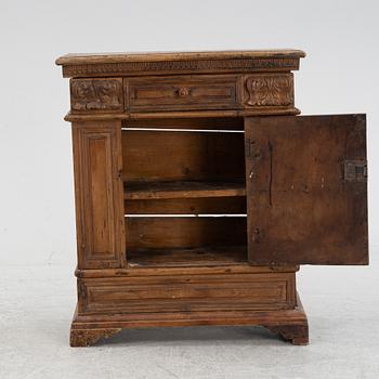 A Baroque style cabinet, circa 1900 with older parts.
