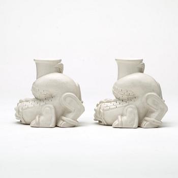 Wilhelm Kåge, a set of stoneware figures of a 'dragon puppy' and two 'dragon puppies' with candle holders, Gustavsberg, ca 1940.