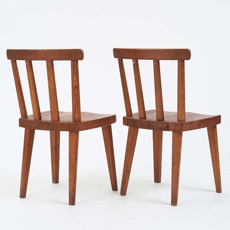 Axel Einar Hjorth, a pair of stained pine 'Utö' chairs, Nordiska Kompaniet, Sweden 1930s.