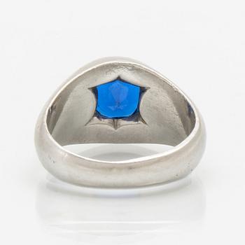 A platinum ring with a synthetic spinel.