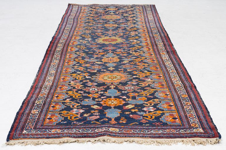 A north-west Persian, semi-antique runner, c. 340 x 110 cm.